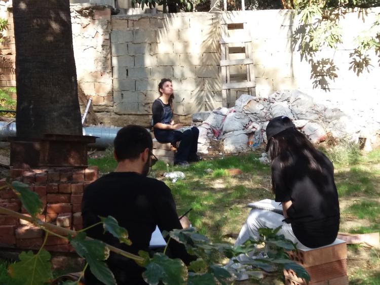 Fine art students of the University of Nicosia working in situ mapping the palm trees that appear in the same place today as on Kitchener's map.